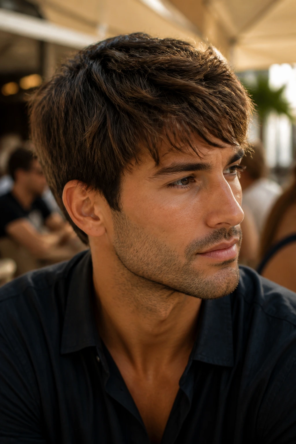 Portrait of a man with short layered haircut achieved by scissor cut