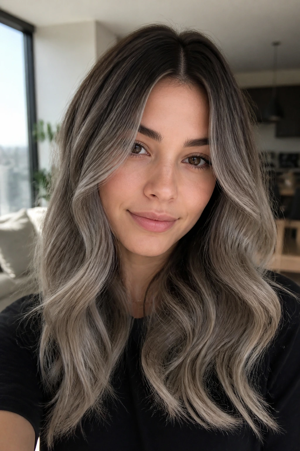Shadow-root ash gray balayage with soft waves on real person