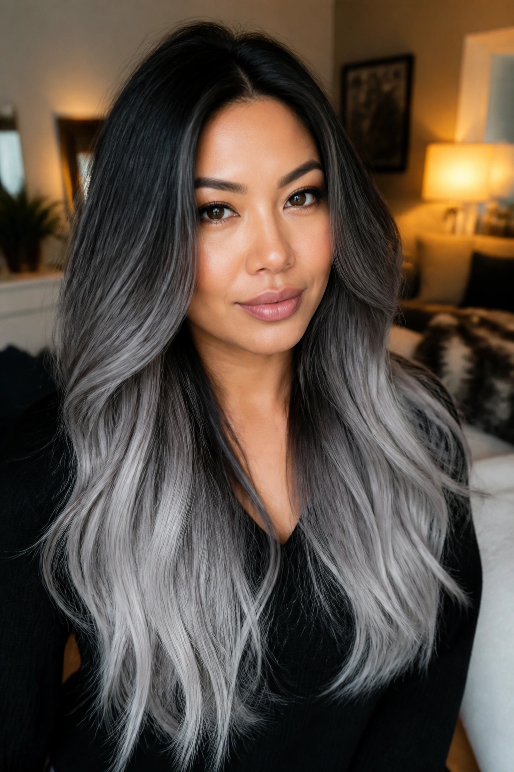 Close-up of hair with a soft shadow root fading into silver ends