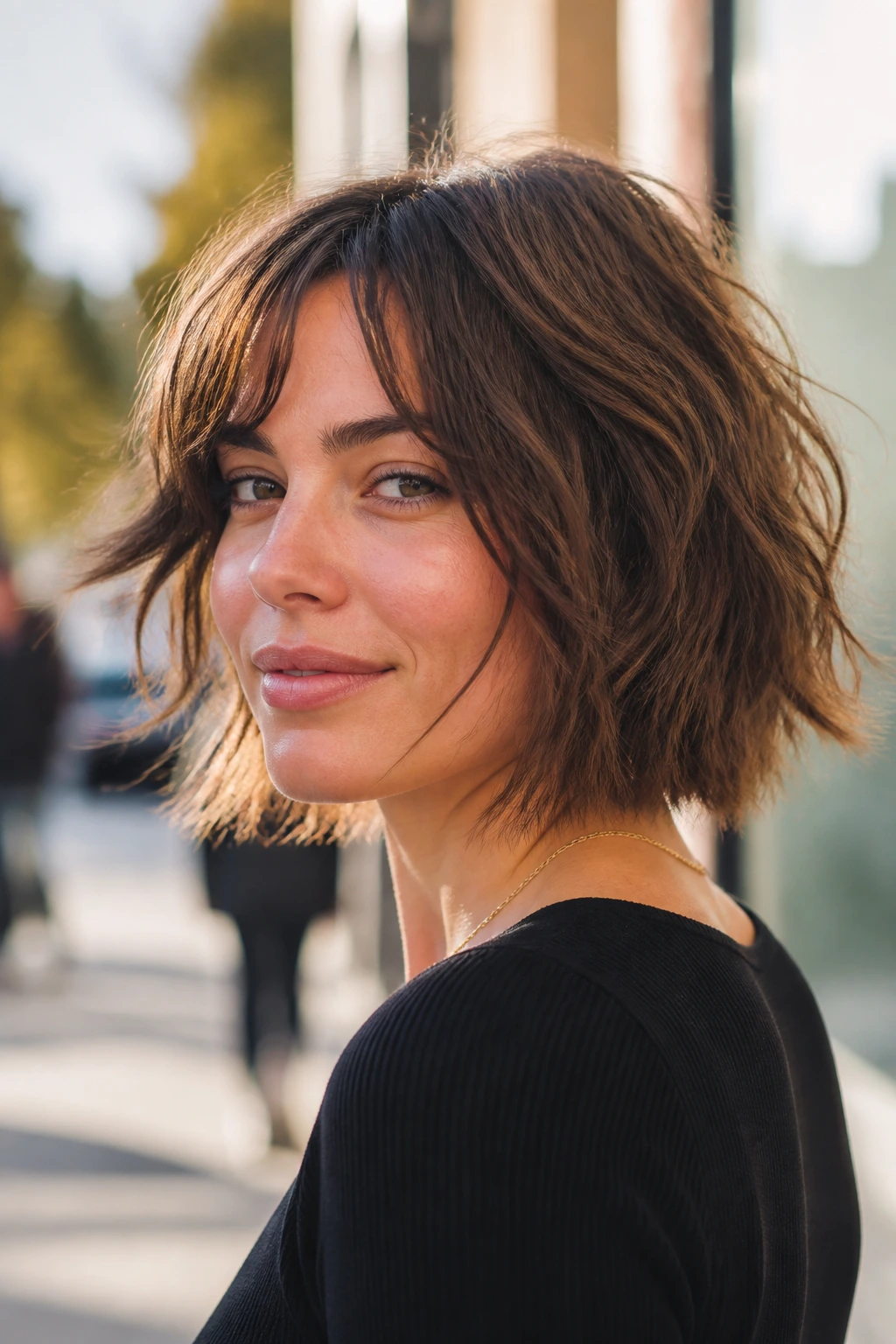 Close-up of a real woman with shaggy bob piecey ends outdoors