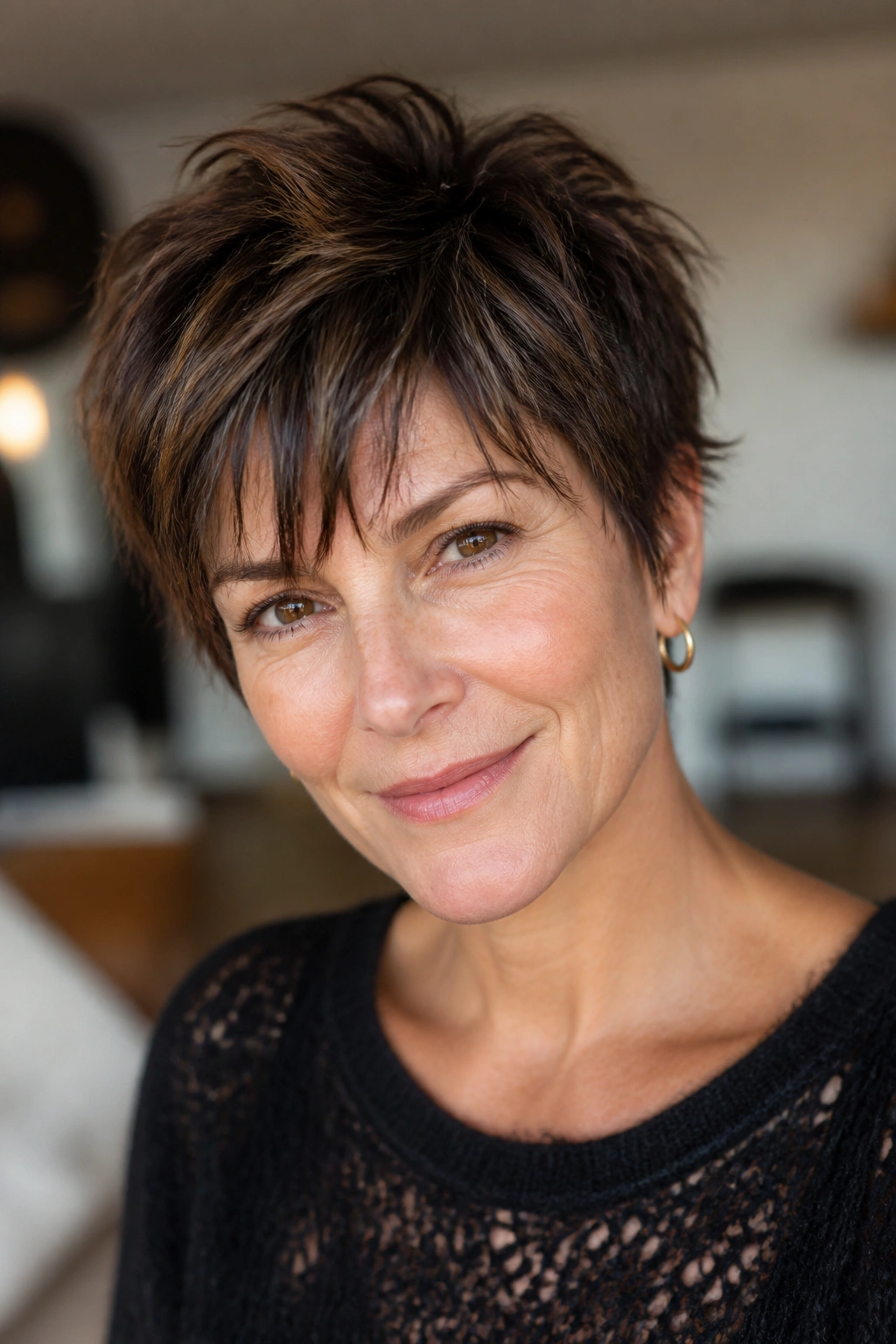 Real woman with a shaggy mini pixie and uneven fringe in natural light