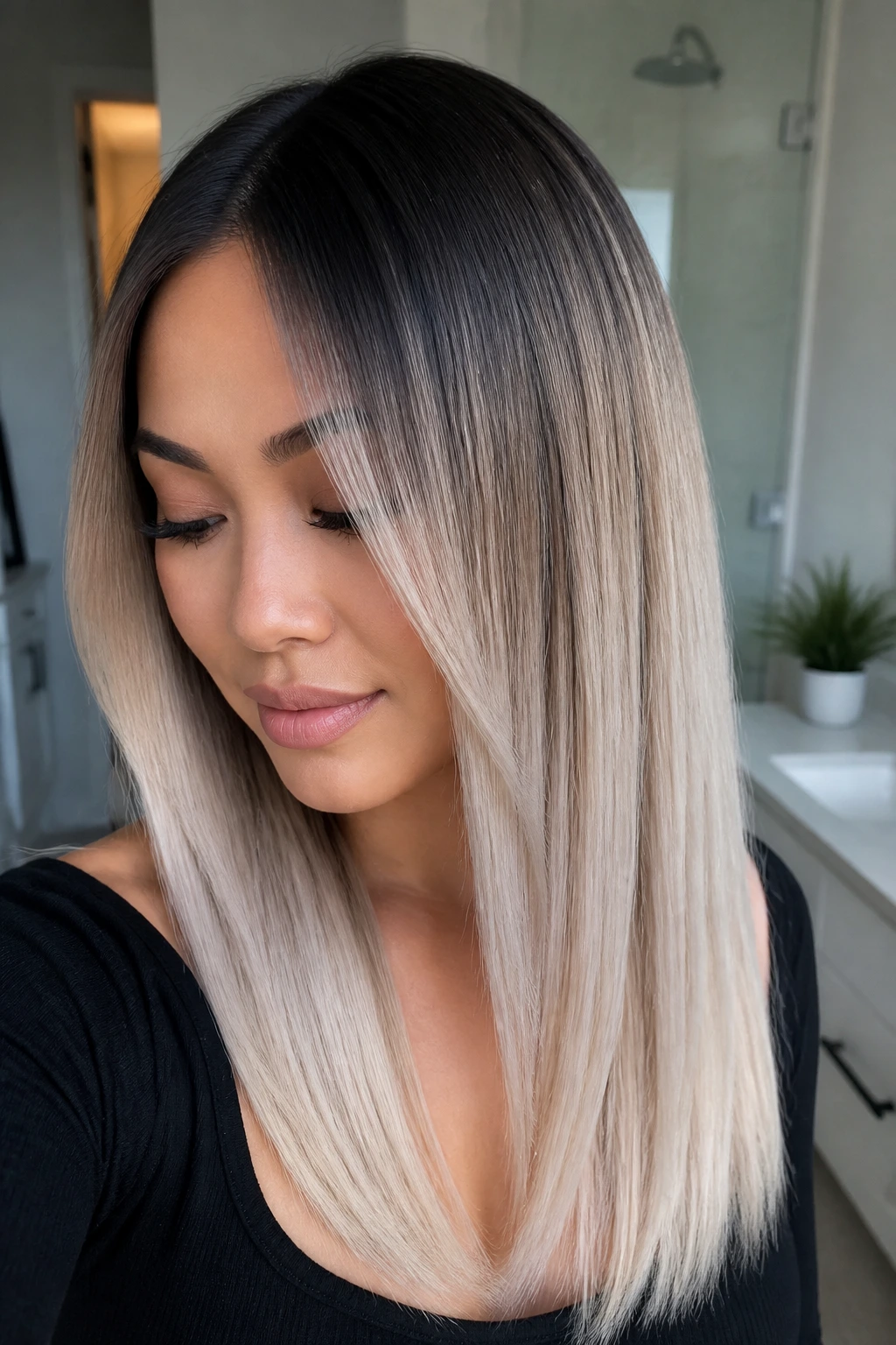 Real woman with silver-blonde fade on dark roots
