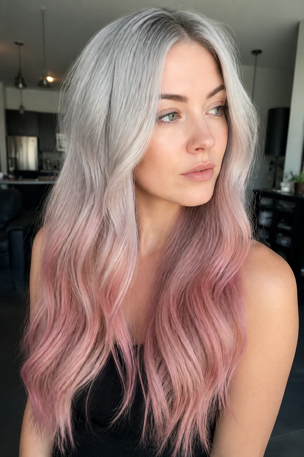 Close-up of a real woman with silver-blonde to dusty bubblegum pink hair.