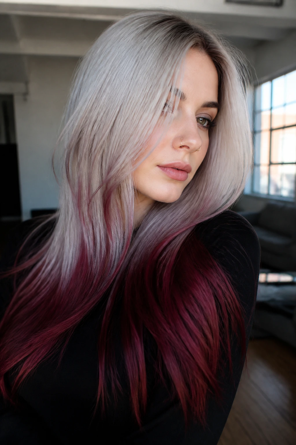 Close-up of a real woman with silver-gray blonde and oxblood ends