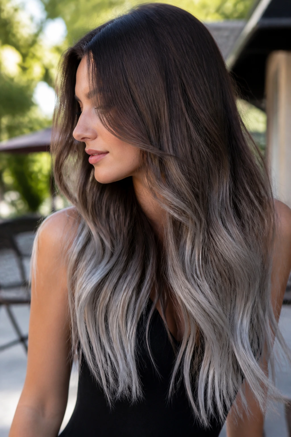 Profile shot of long brown hair with silver ombré ends.