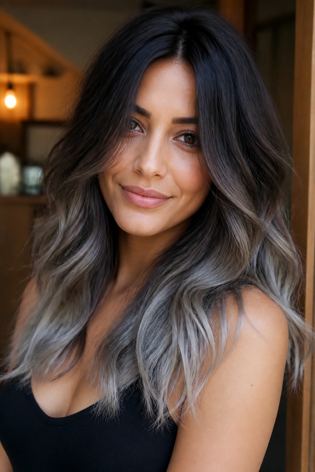 Close-up portrait of a real person with silver ombré ends on dark chocolate hair
