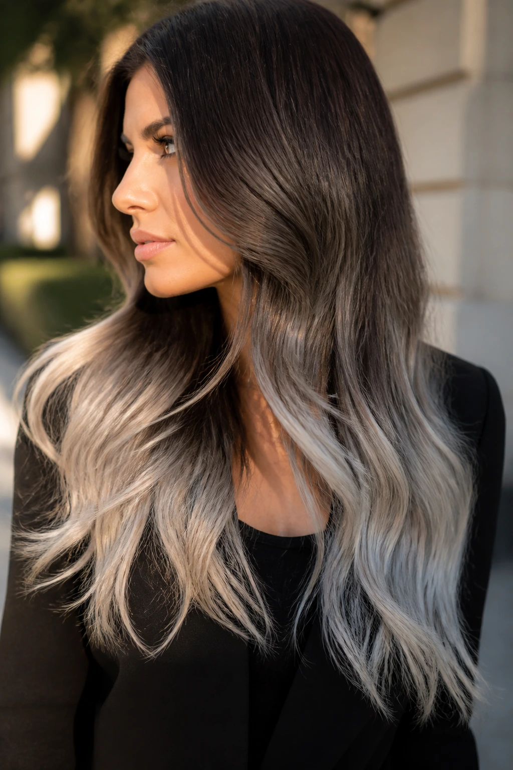 Close-up of a real woman with long hair ending in silver ombré
