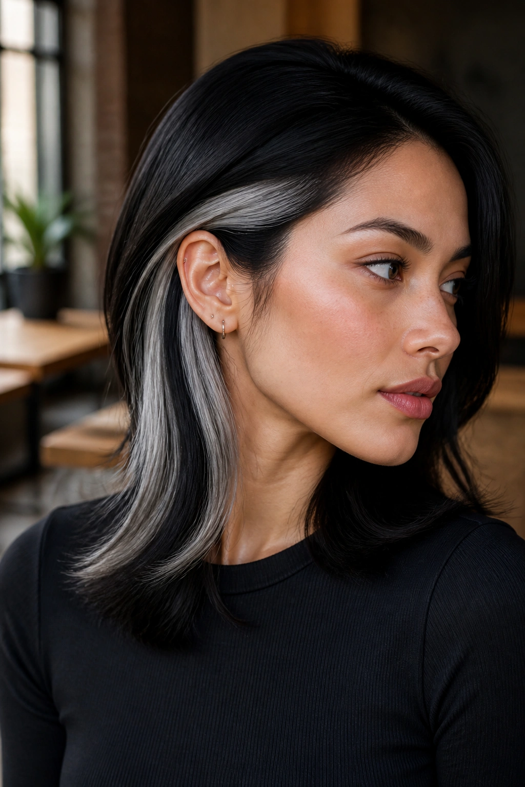 Close-up of a real person showing subtle silver peekaboo panels under the crown.