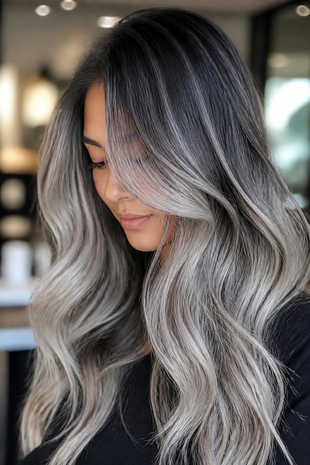 Portrait of person with silver smoke balayage in a salon lighting