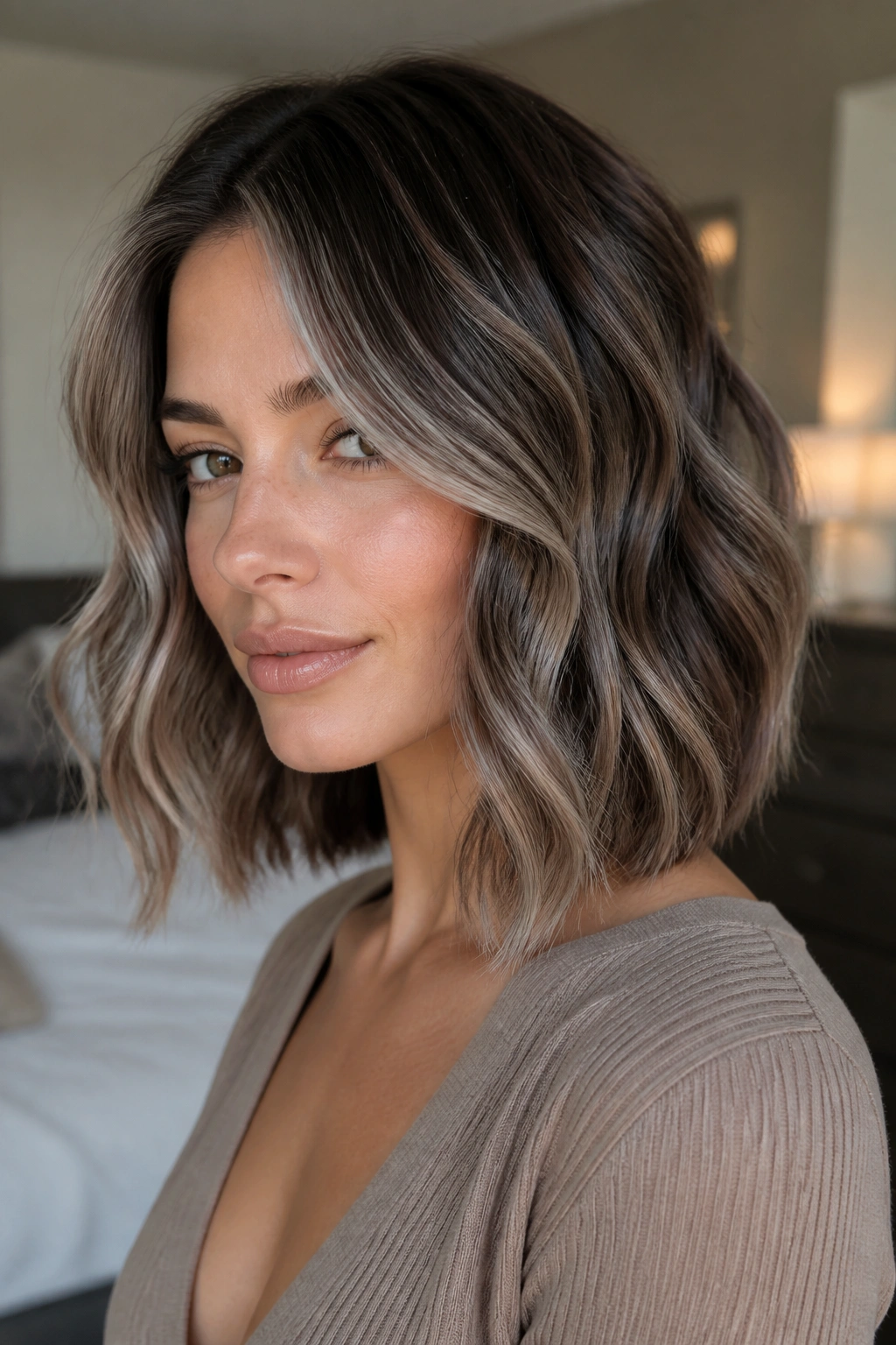 Close-up of wavy lob with silver veil highlights
