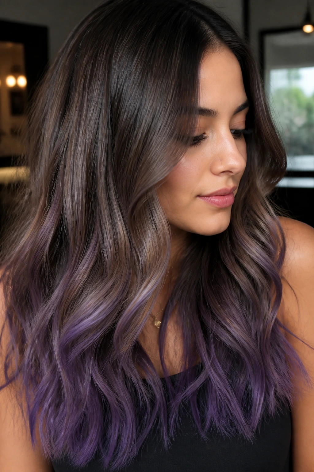Portrait of a real woman with soft smoke purple ends on long hair