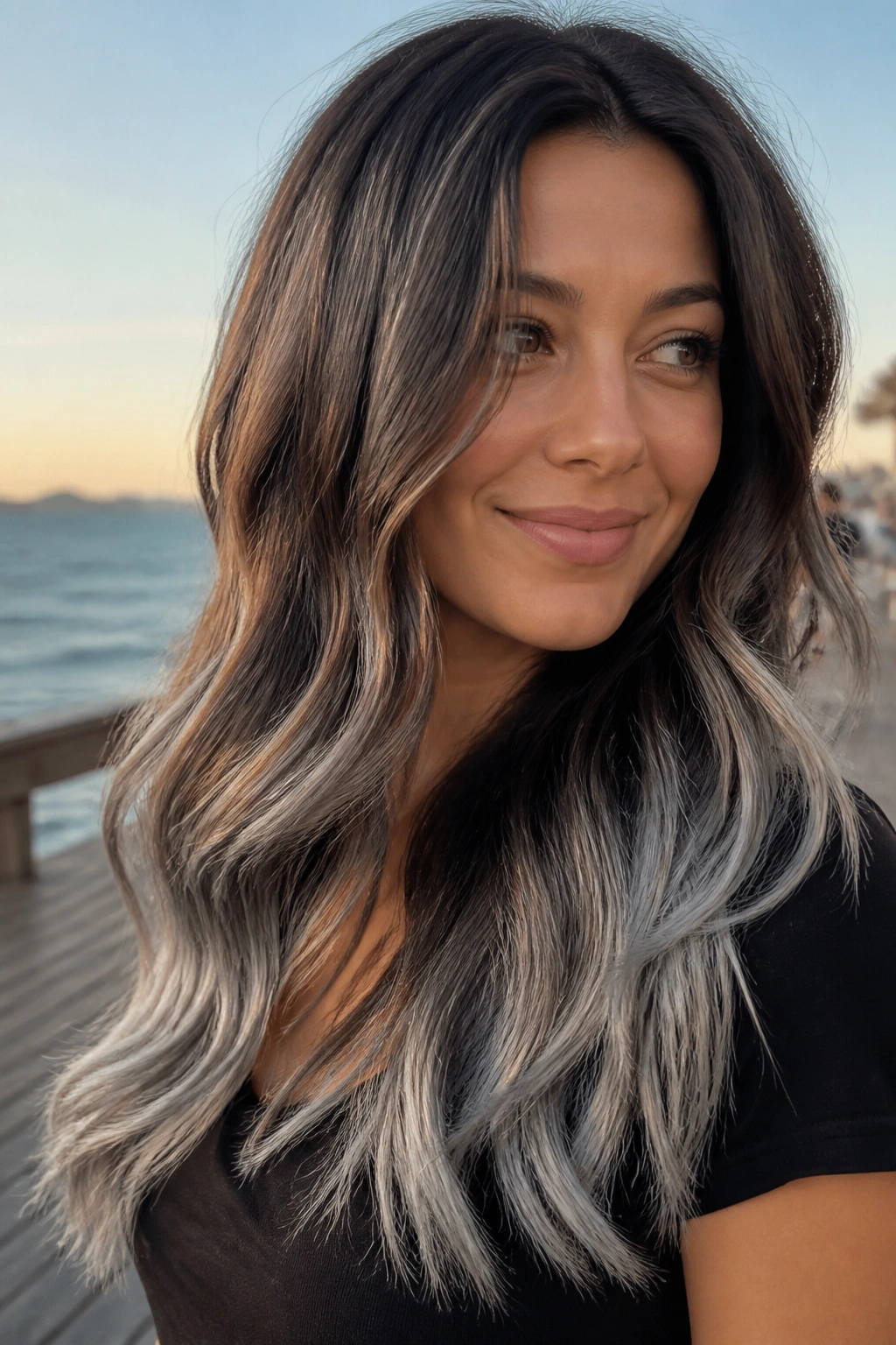 Close-up of a real woman with smoky brown balayage and silver ends