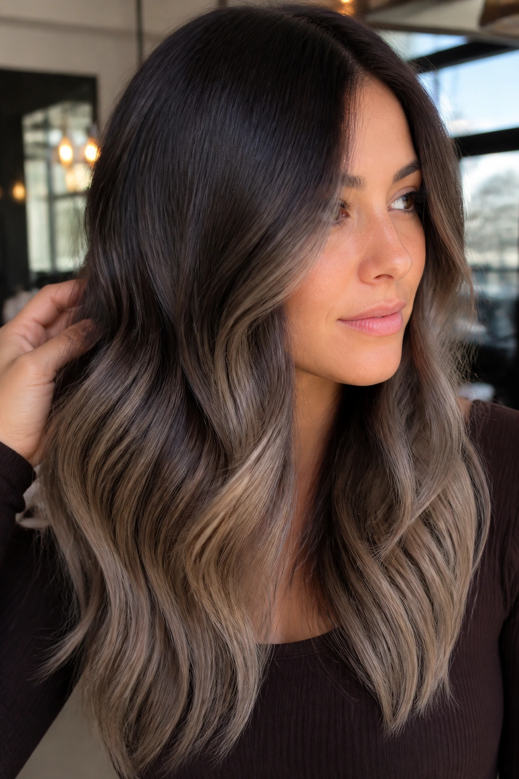 Portrait of chocolate brown hair with smoky beige melt balayage