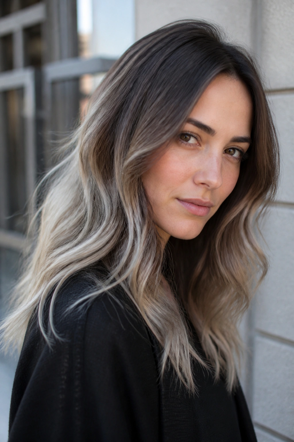 Close-up of a real woman with smoky brunette to silver blonde ombré.