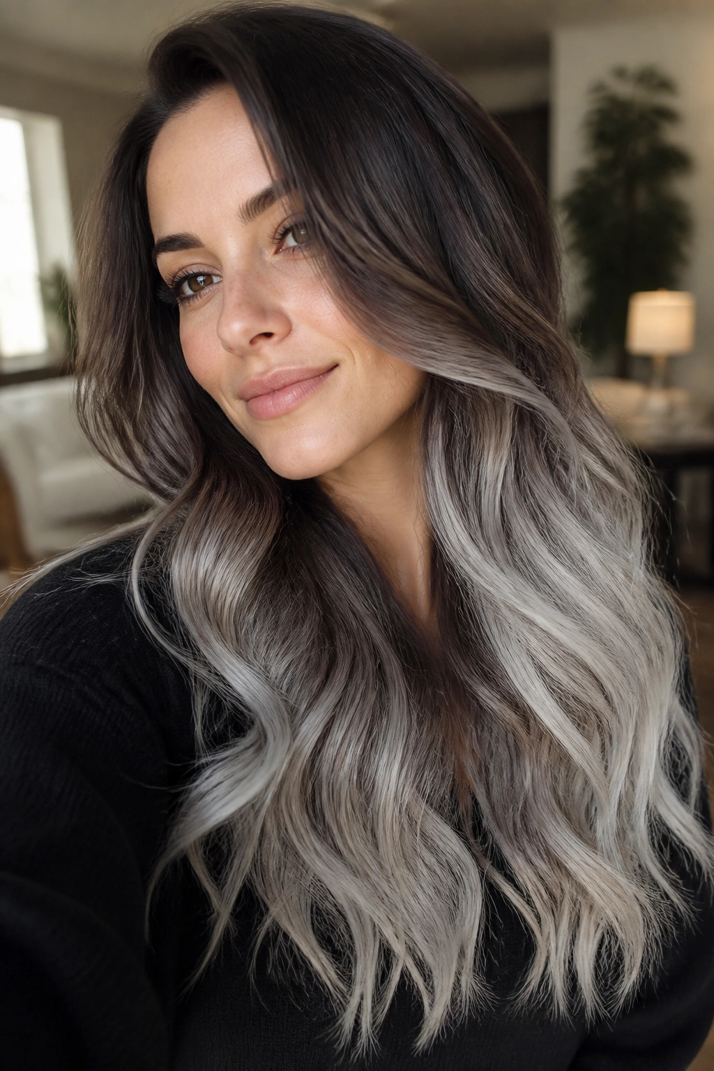 Close-up of smoky brunette to silver ends ombre on real woman in window light