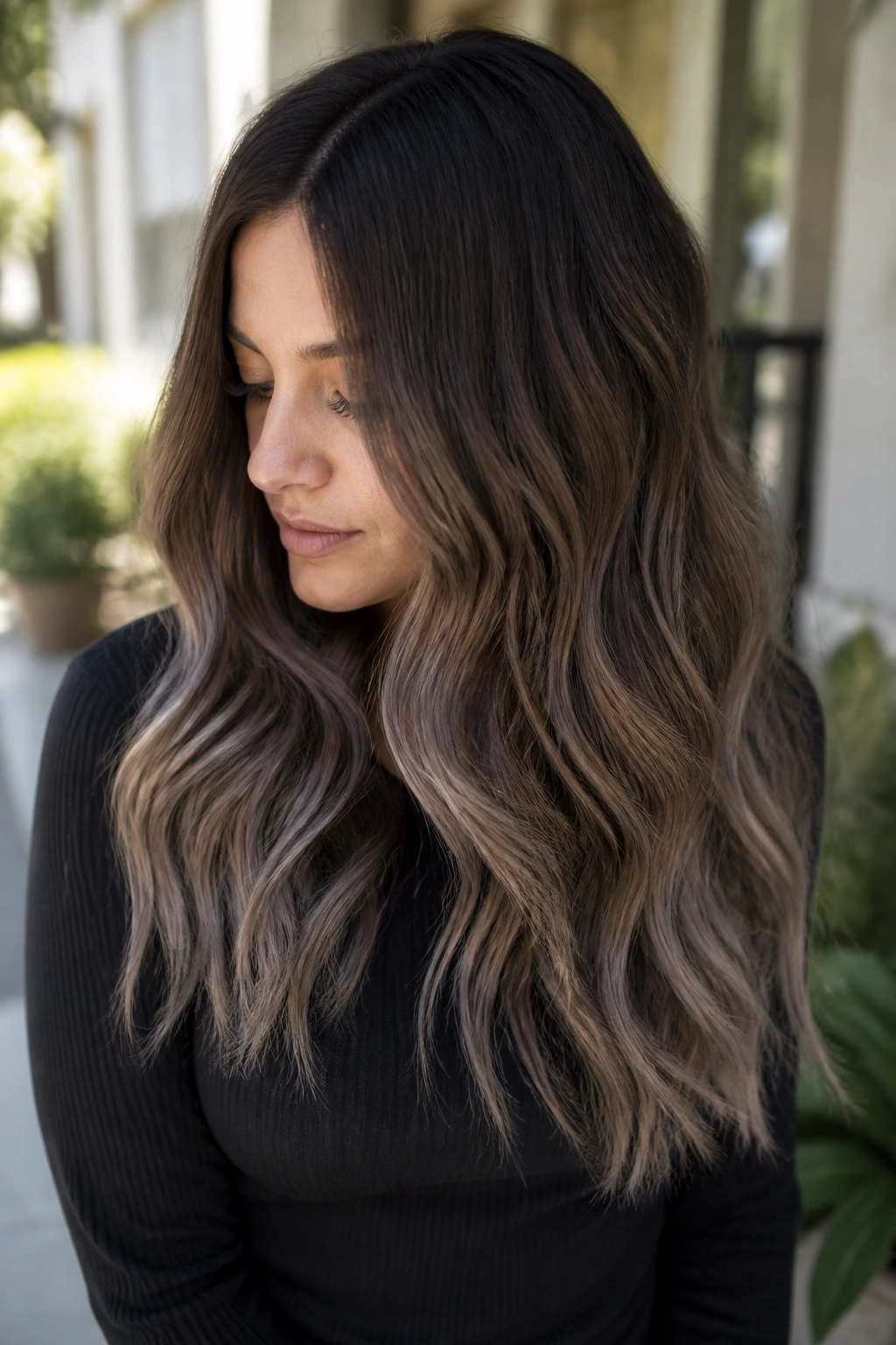 Portrait of smoky chocolate ombré hair with deep root to taupe ends on real person