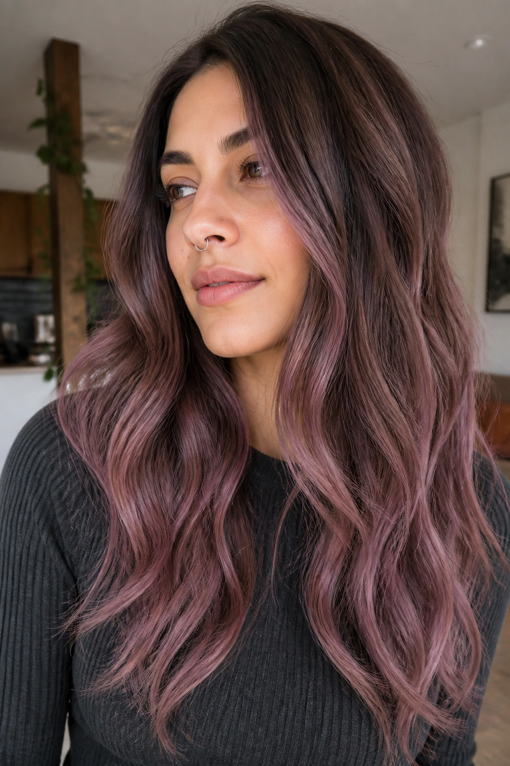 Close-up of ash brown hair with smoky mauve balayage melt on a real woman.