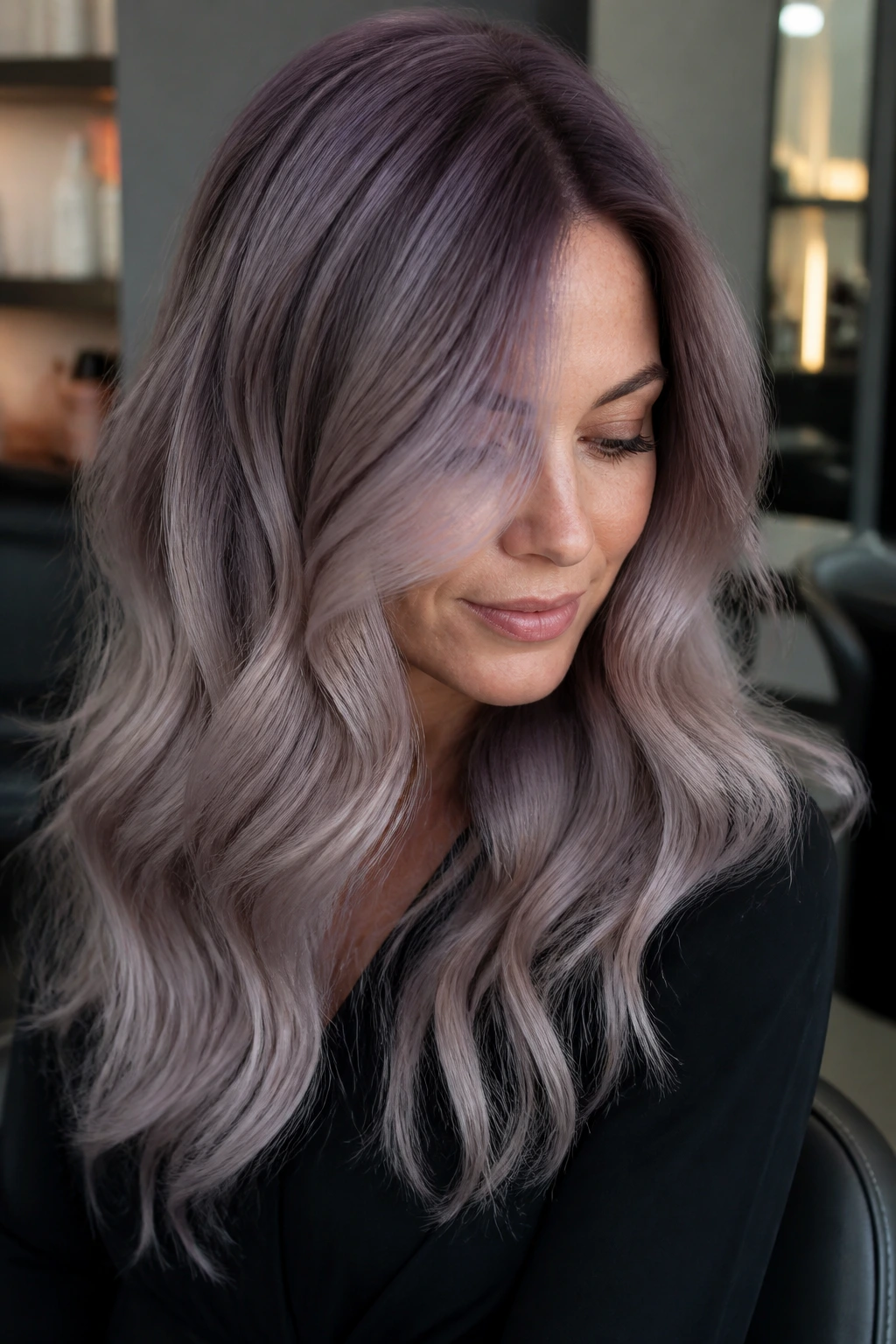 Close-up of smoky mauve roots blending into mauve-grey ends on a real person