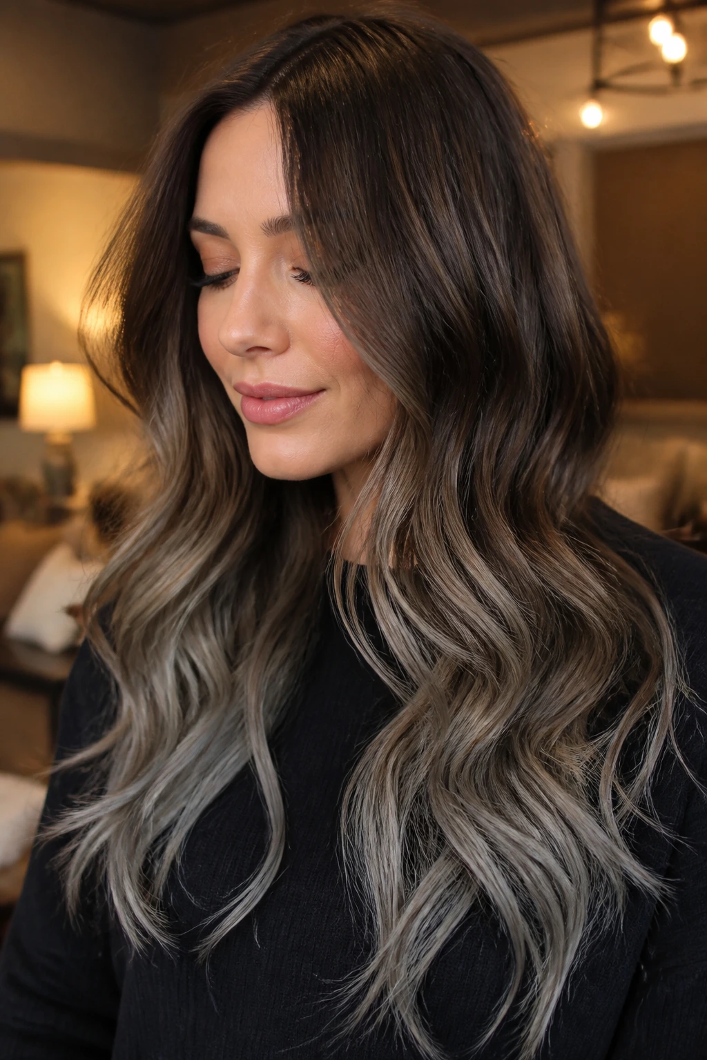 Close-up of chestnut-to-pewter smoky melt balayage on a real woman.
