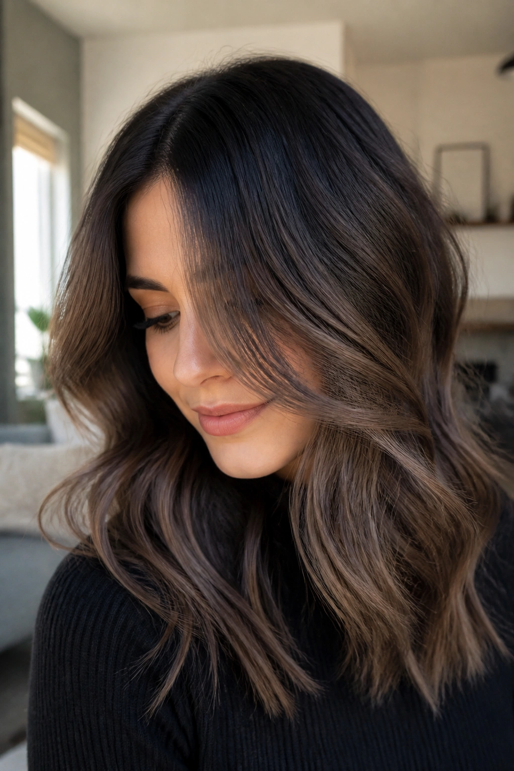 Close-up portrait of real person with smoky mocha melt hair in natural window light