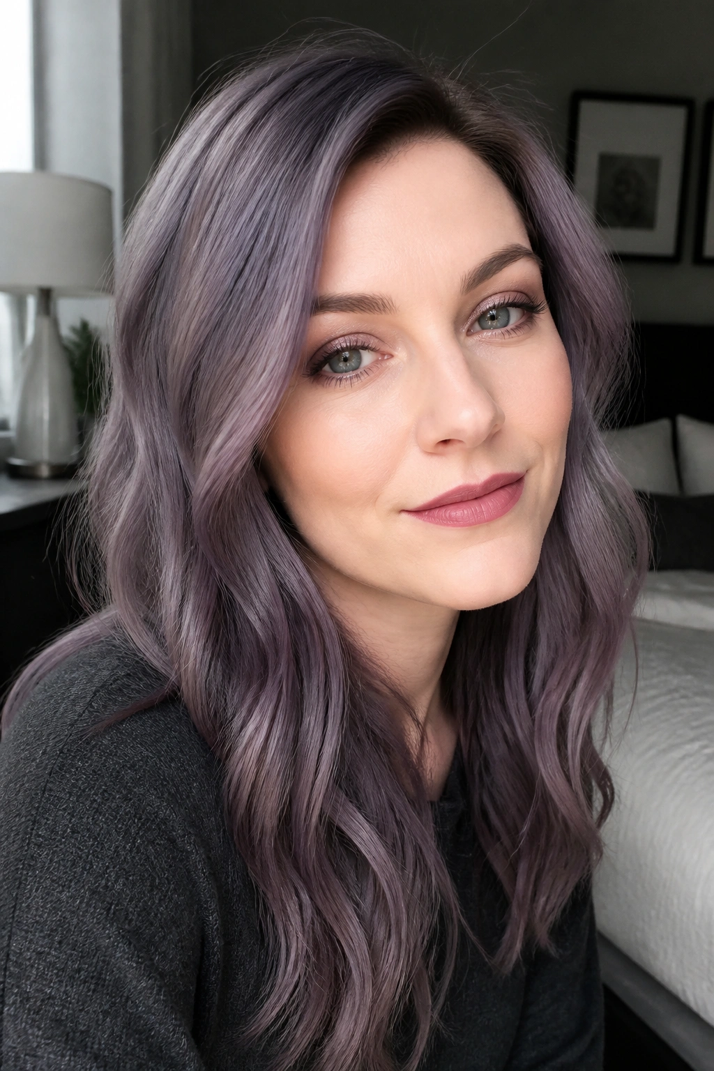 Close-up of a real person with smoky orchid hair under soft window light