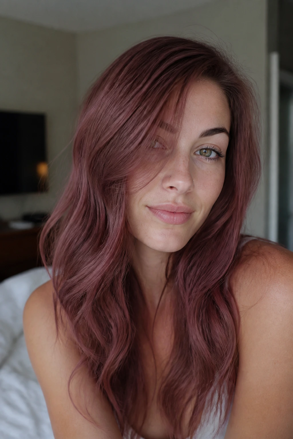 Close-up portrait with smoky raspberry auburn hair on cool olive skin