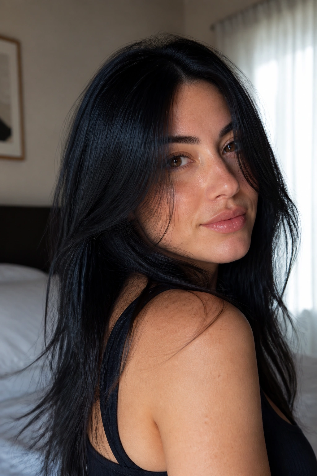 Close-up of a real person with soft black hair and blue undertones
