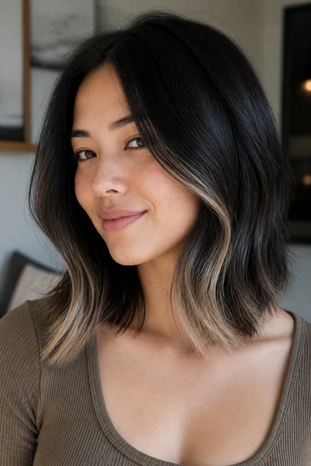 Real woman with soft black midi hair and beige blonde air touch ends