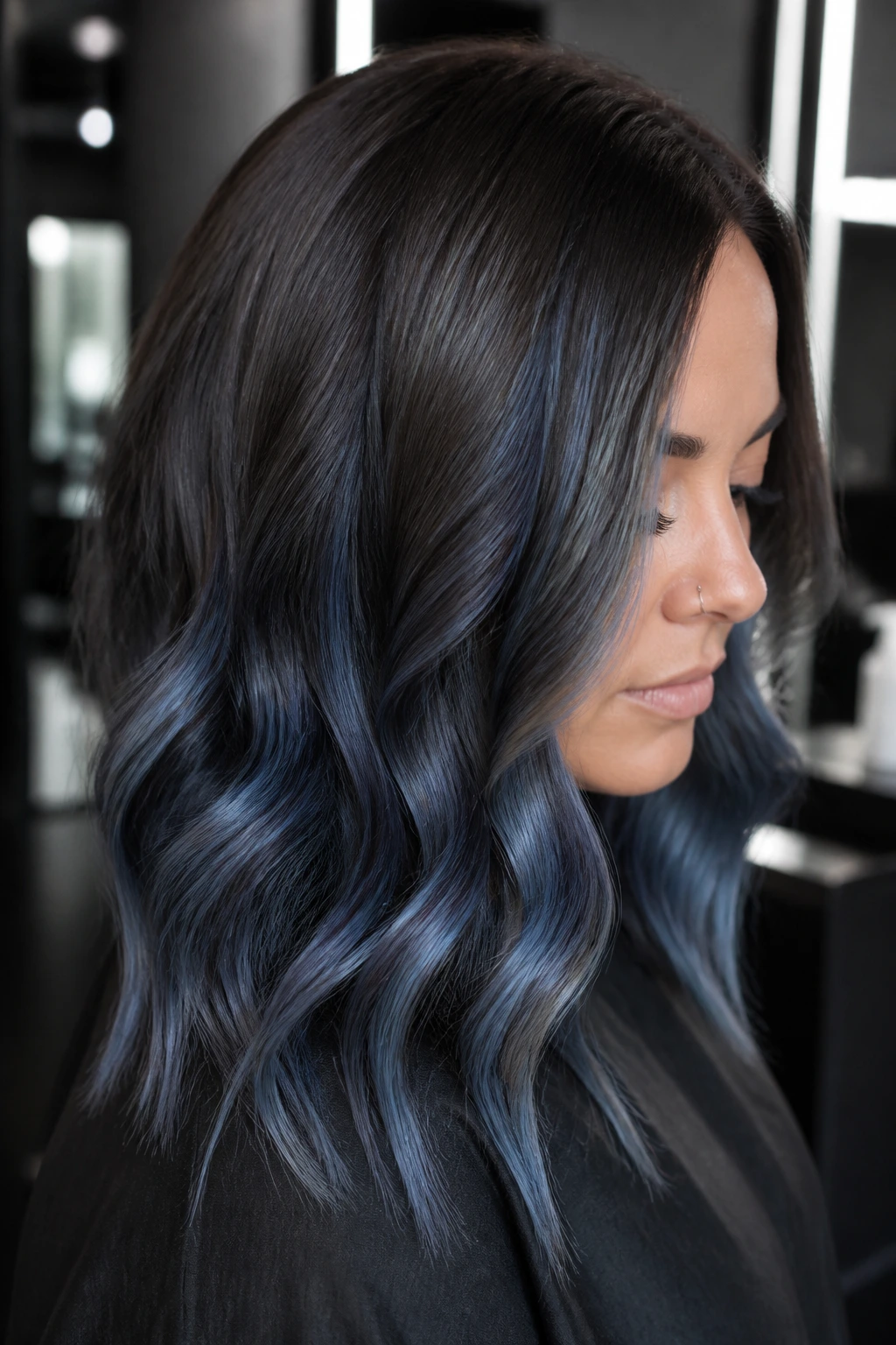 Dark mocha hair with steel blue balayage accents