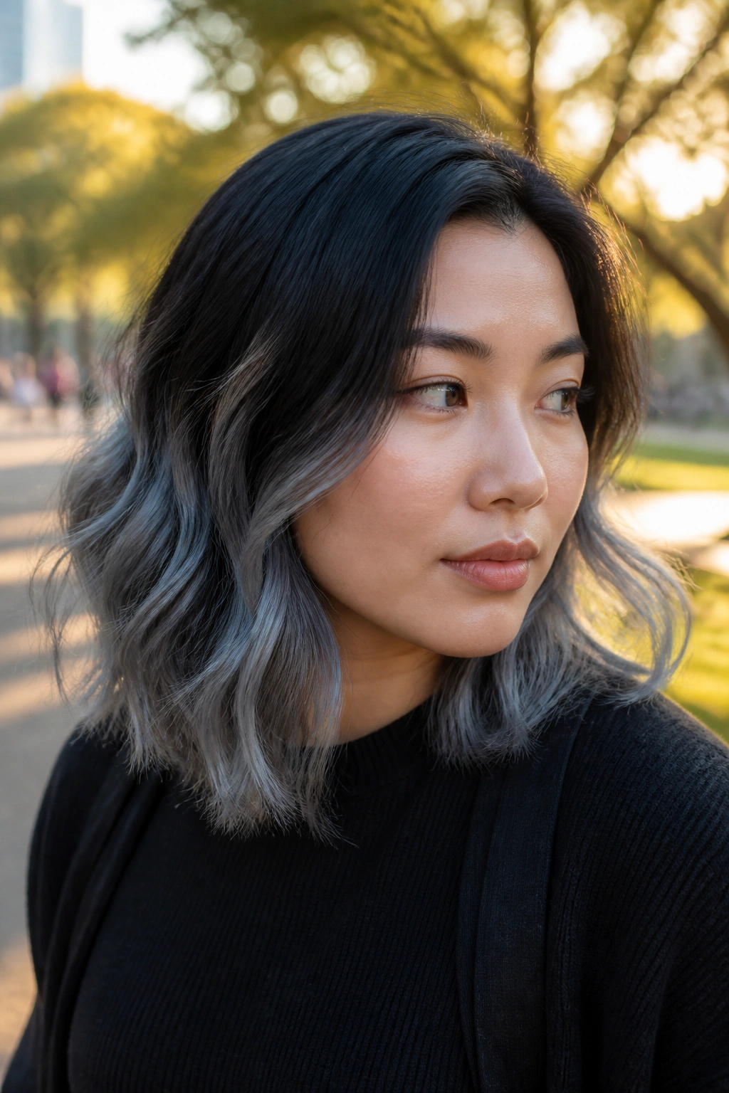 Portrait of a woman with steel-gray midlength ends on shoulder-length hair