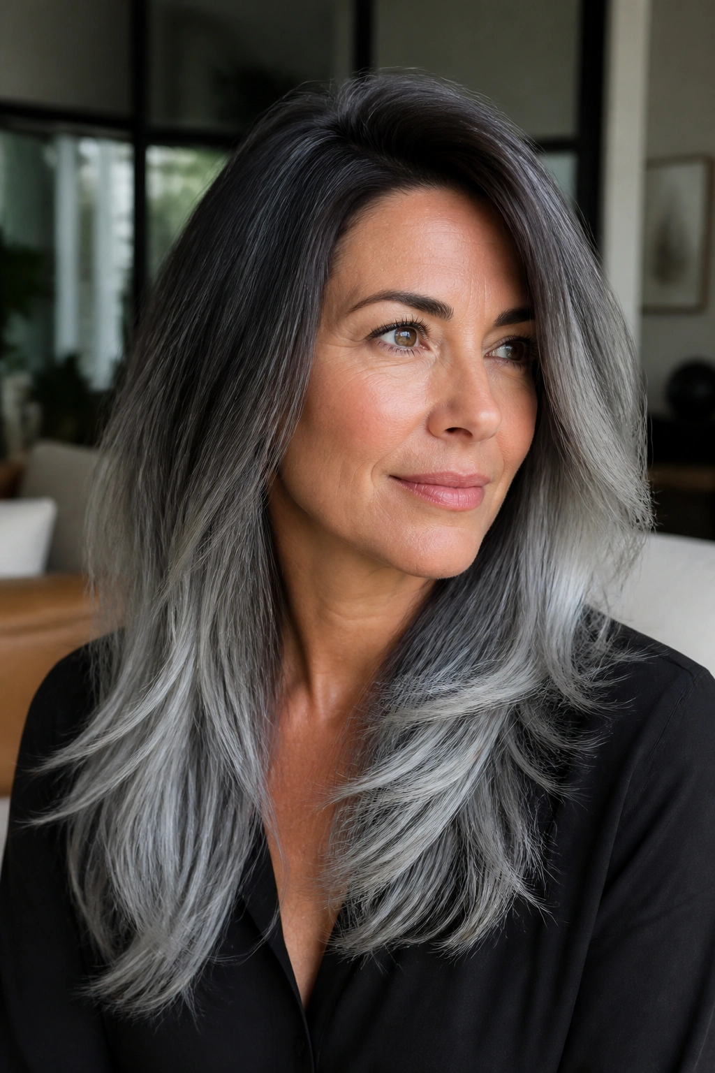 Portrait of a real woman with steel ombré and long layers