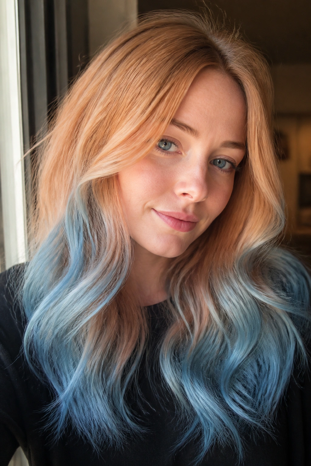 Close-up portrait of a real woman with strawberry blonde hair fading to sky blue ends