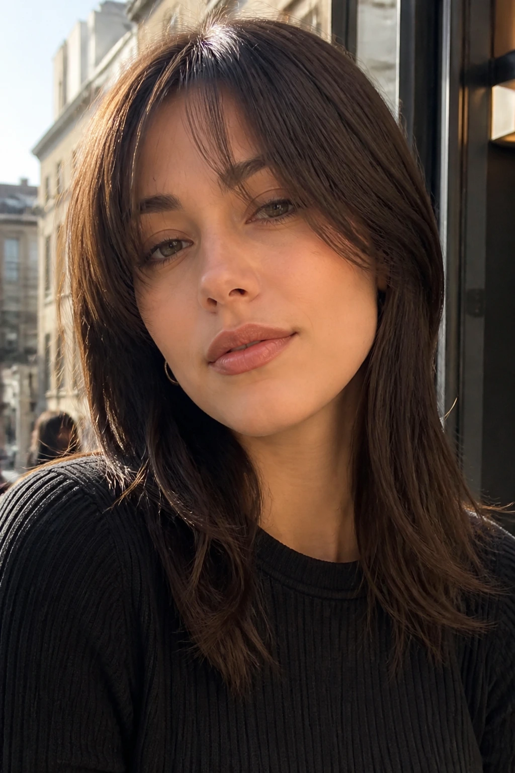 Portrait of a real person with tapered edge bangs during morning city light