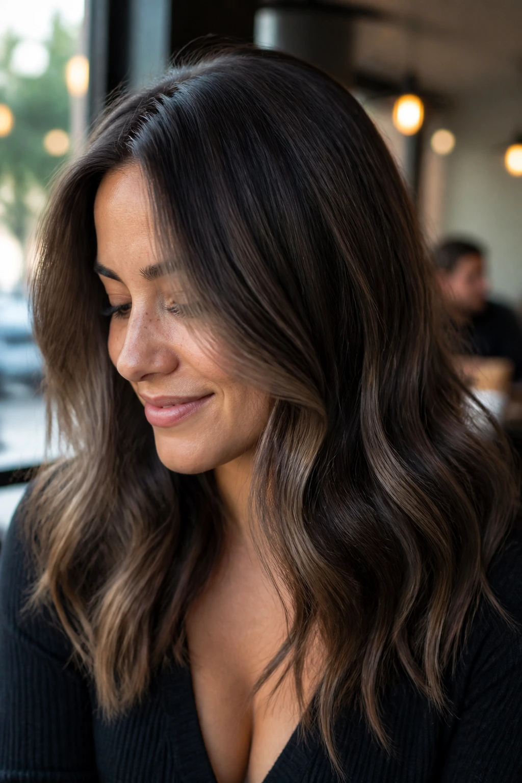 Close-up of brunette with taupe lowlights for a smoky neutral look