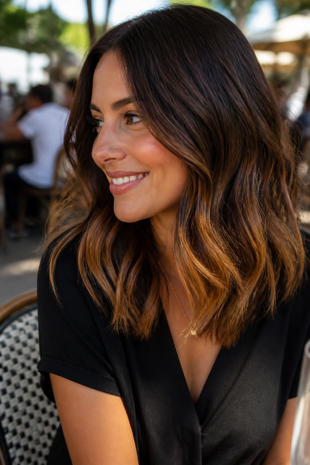 Real woman with toffee ribbons in mid-length waves.