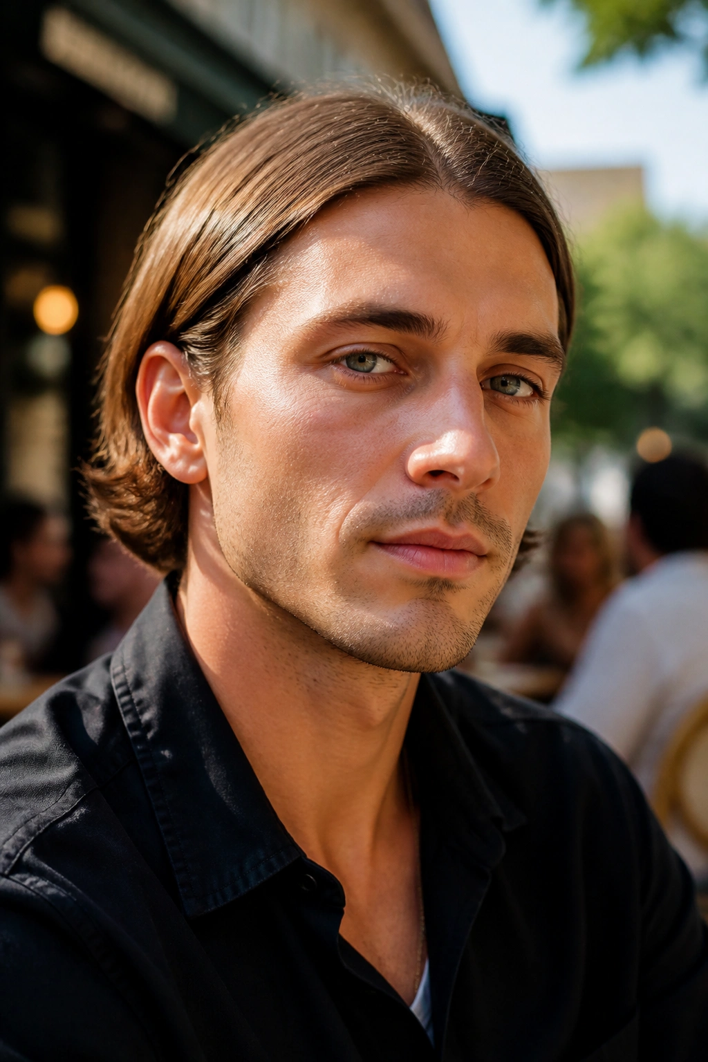Portrait of a man with a tucked-behind-the-ears bob