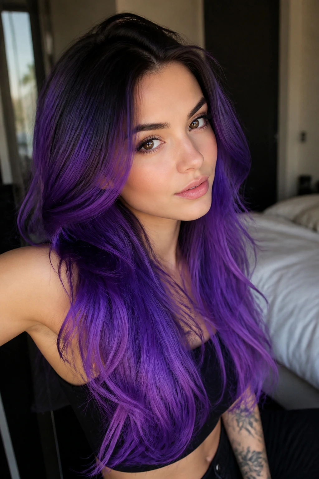 Close-up of a real person with bright ultraviolet hair on long layers, neon ends and dark roots