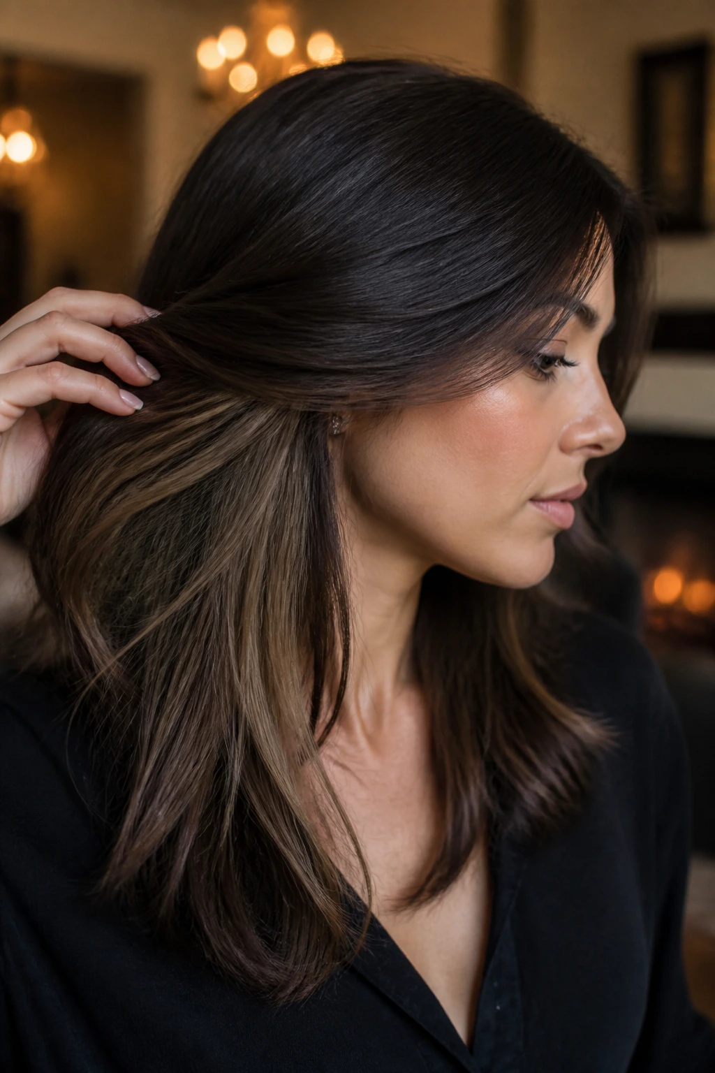 Close-up of a woman showing dark top layer with lighter underlayer glow at nape