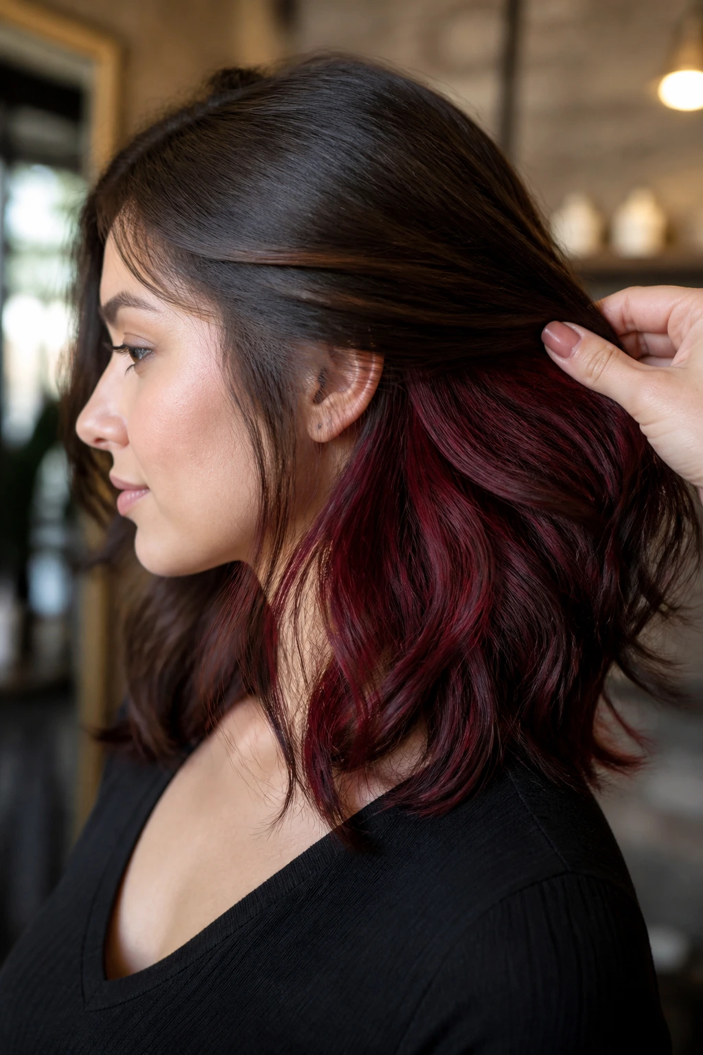 Close-up of a real person showing deeper cherry underlights at the nape