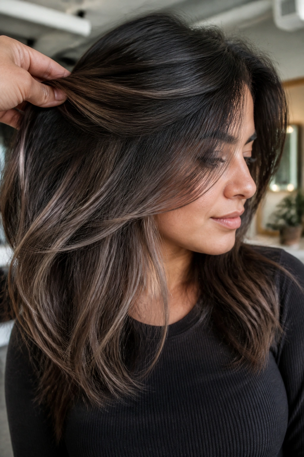 Close-up of a real woman with hidden brown-grey underlights visible as hair moves