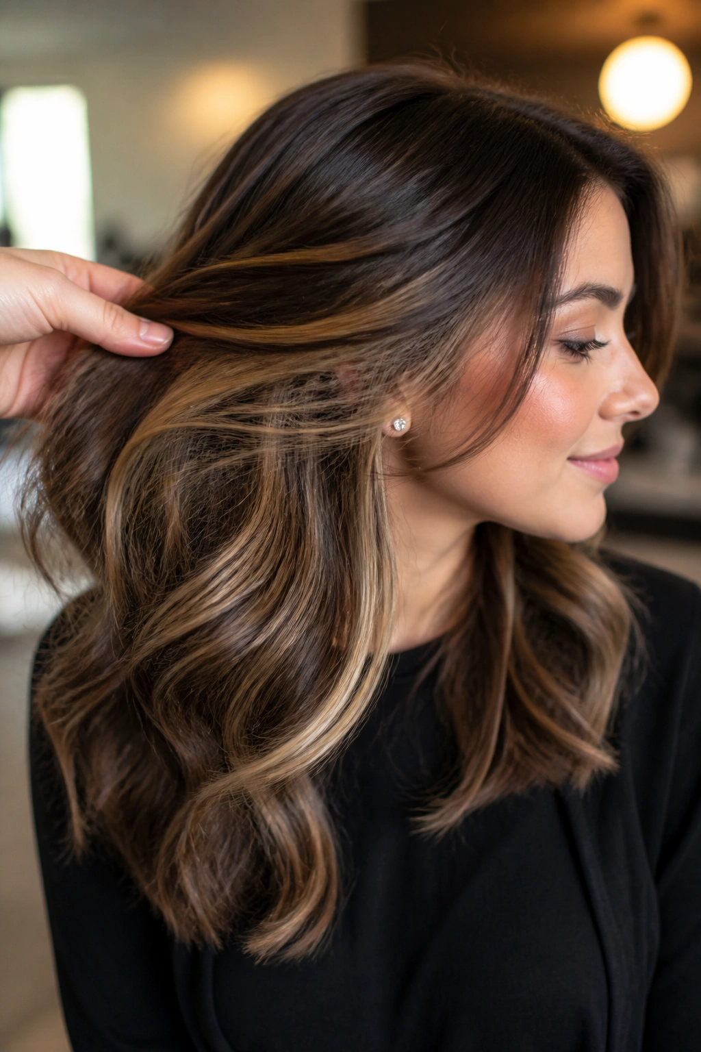 Portrait of a woman showing subtle underlights beneath the top hair layer