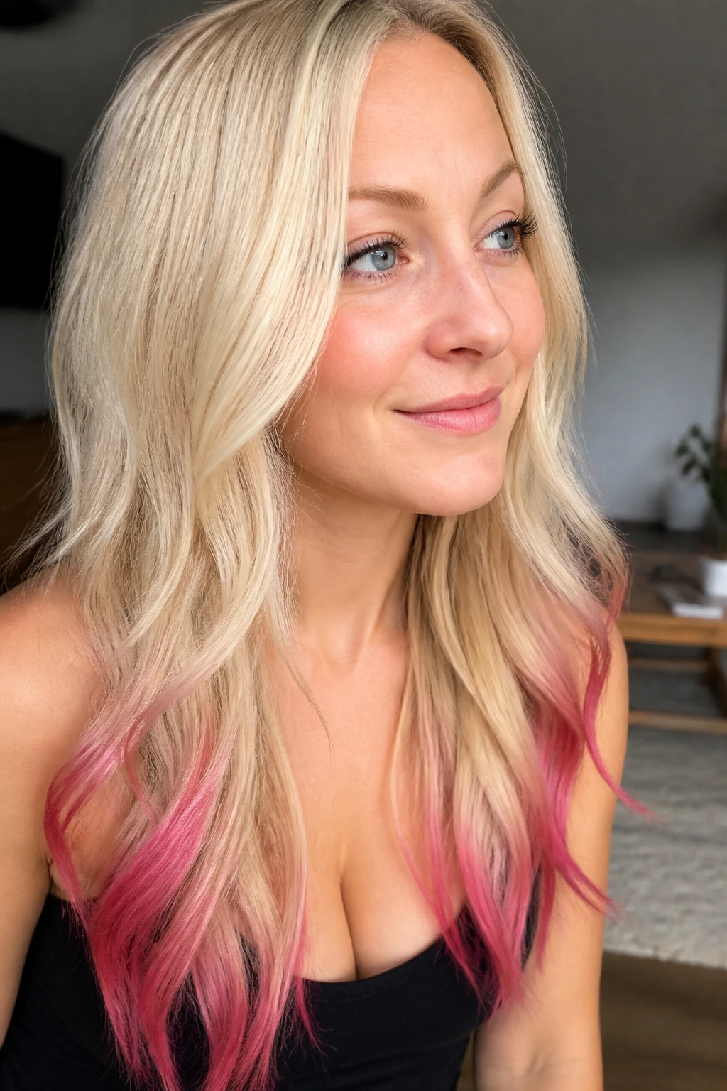 Portrait of a real woman with vanilla blonde and fuchsia-tipped ends.