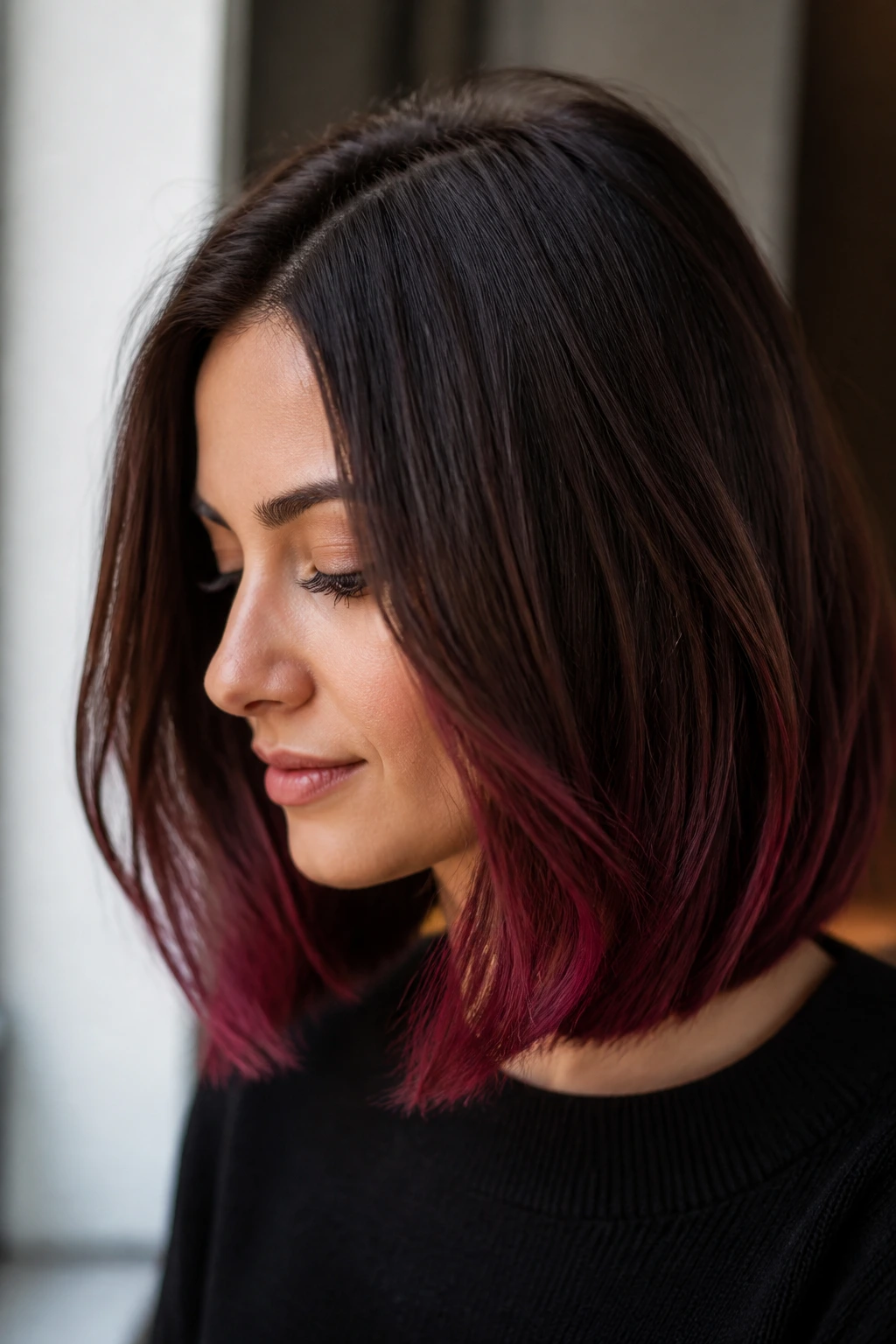 Close-up of a real person with a lob and velvet burgundy tips