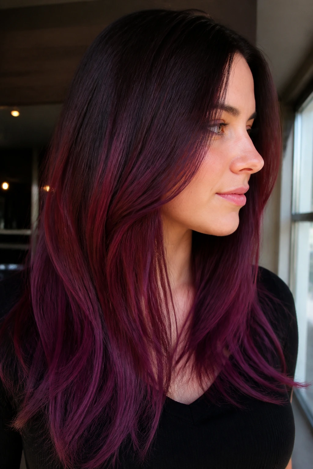Close-up portrait of woman with violet burgundy melt