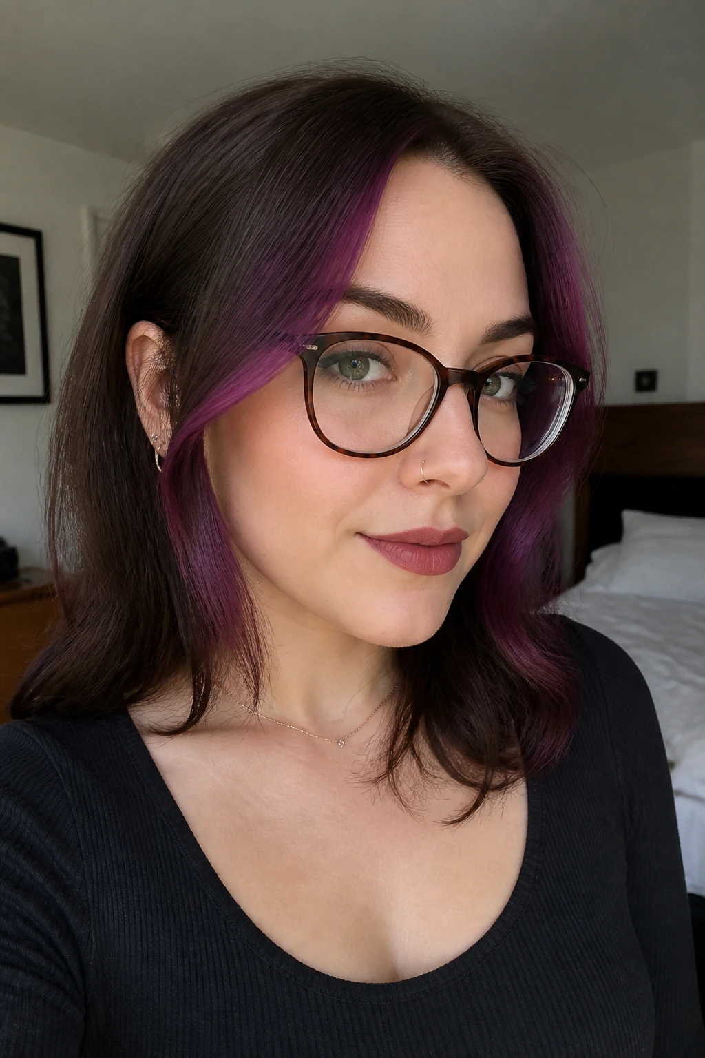 Close-up of real woman with violet burgundy face-framing pieces