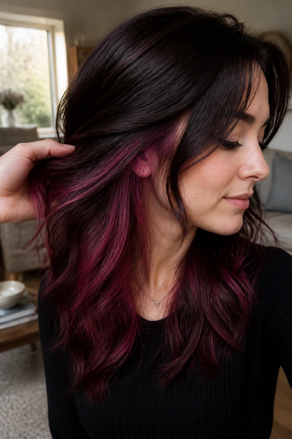 Close-up portrait of a real person with violet cherry peekaboo underlayer visible during movement