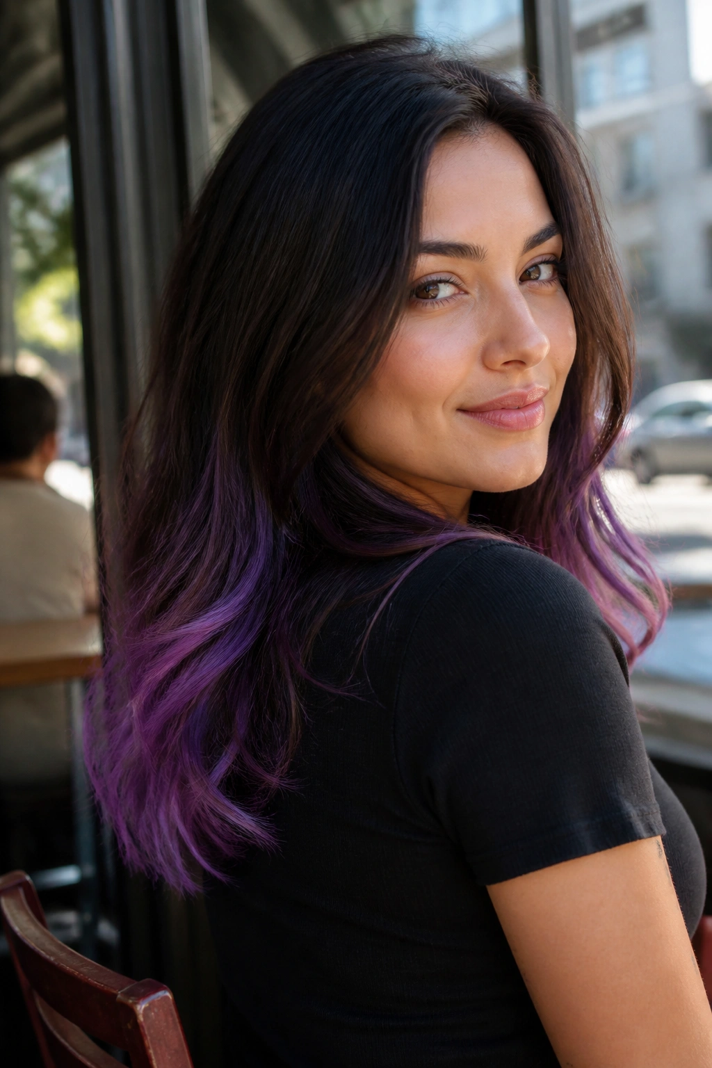 Close-up portrait of a real woman with violet dip-dye ends