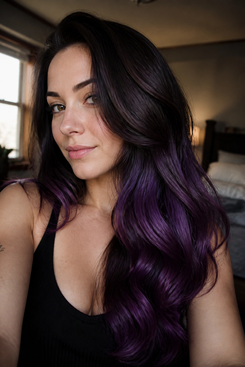 Close-up of a real woman's long hair with a dark-to-violet melt