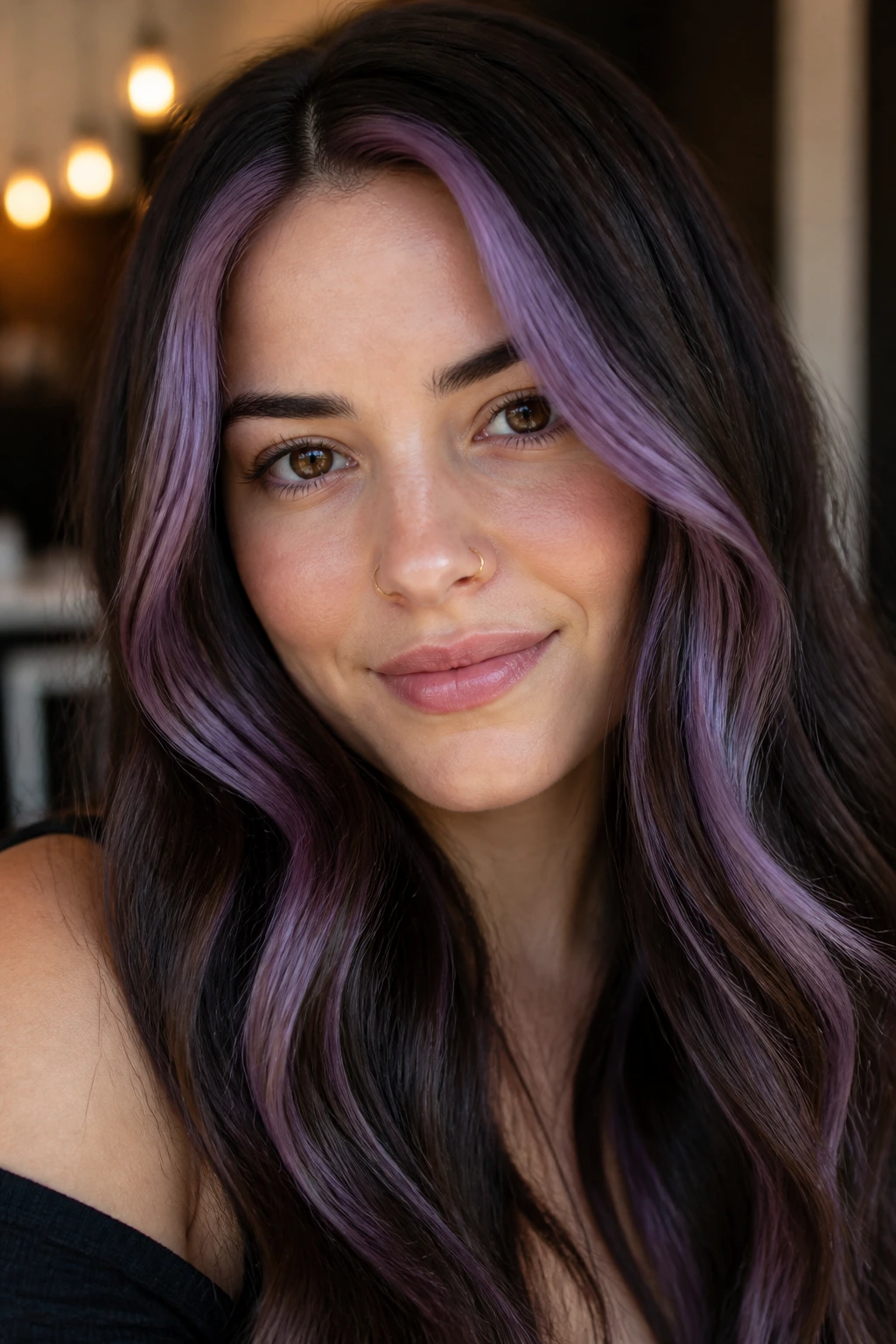 Real person showing violet face-framing money pieces against brunette hair