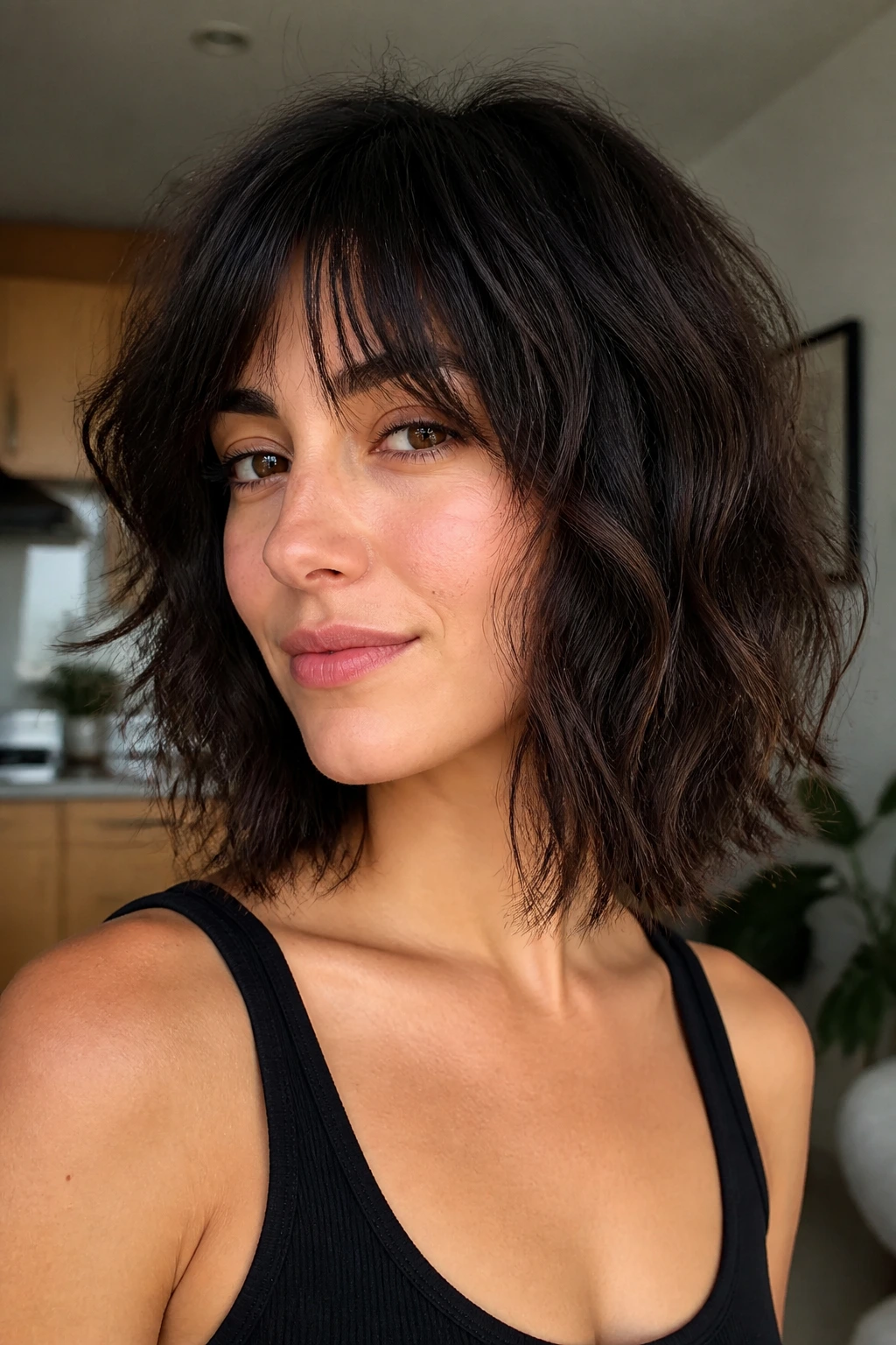 Close-up portrait of a real woman with low-maintenance wash-and-go shag lob hairstyle